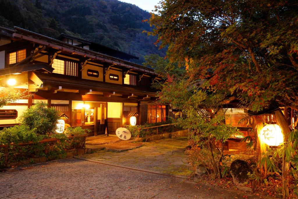 a japanese house with lights in front of it at Yumoto Choza in Takayama