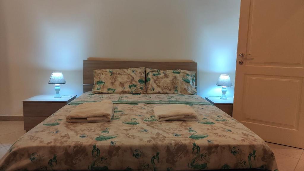 Postel nebo postele na pokoji v ubytování Appartamento Corso Savoia