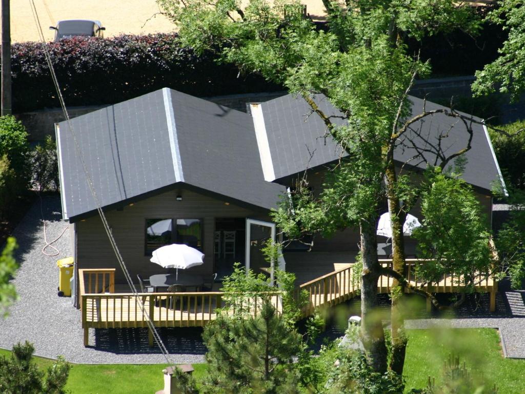 an aerial view of a house with a deck at Scenic chalet in Vieuxville with terrace in Vieuxville