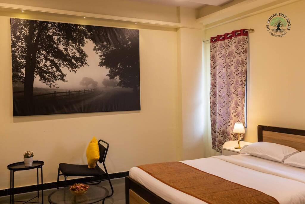 Postel nebo postele na pokoji v ubytování The Banyan Tree Adobe