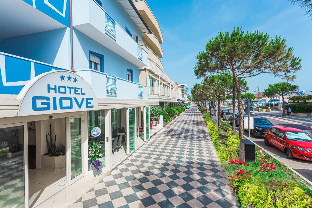 a street in front of a hotel give at Hotel Giove in Cesenatico