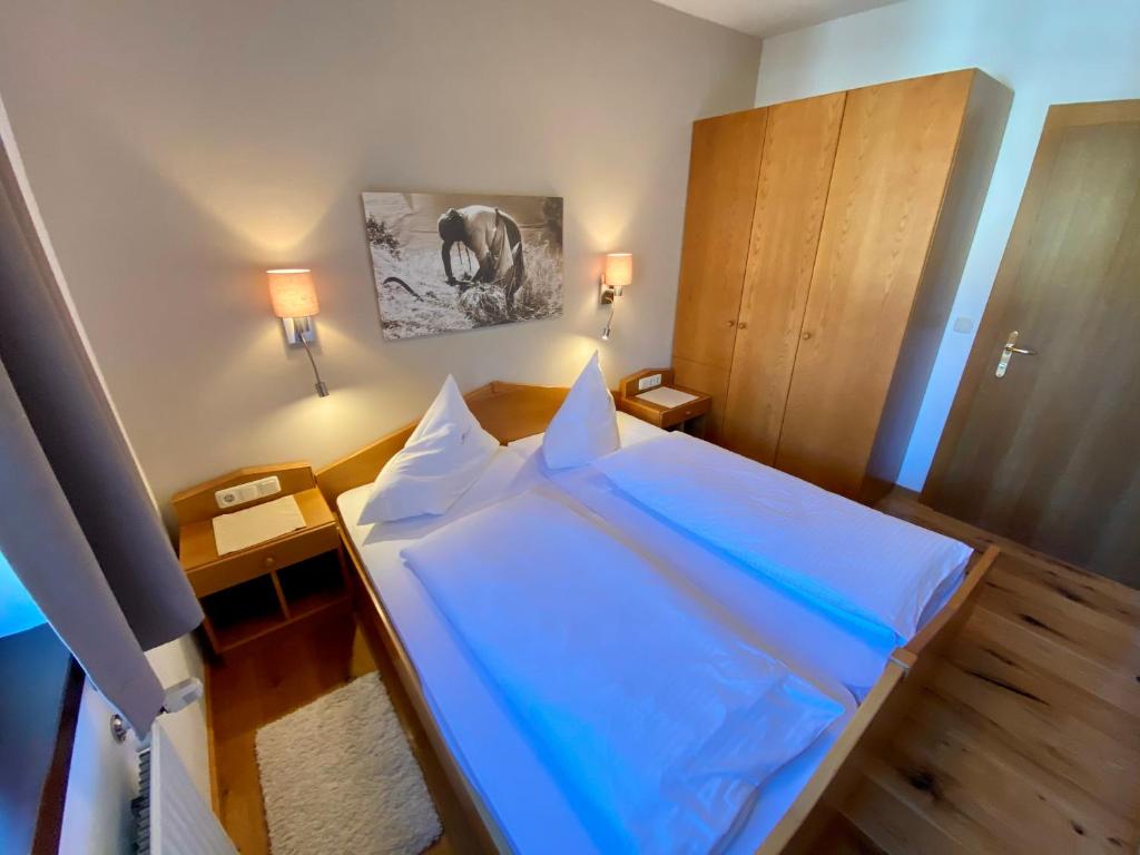Postel nebo postele na pokoji v ubytování Appartements Oswaldeck