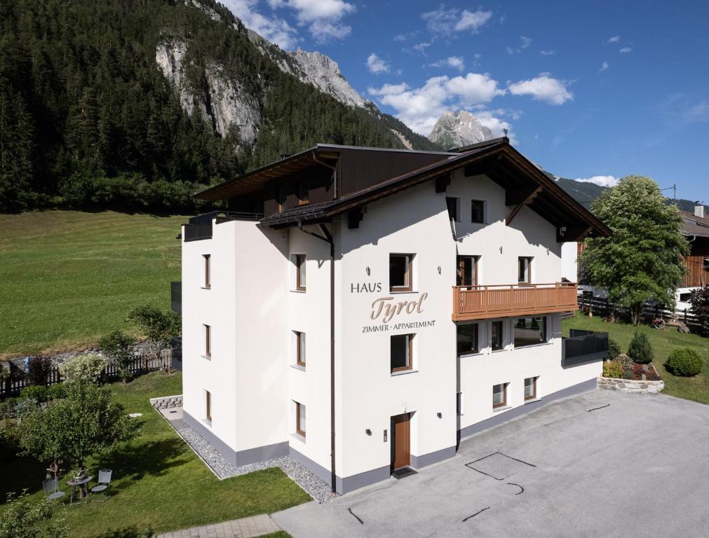 an aerial view of a hotel in the mountains at Appartements Tyrol in Pettneu am Arlberg