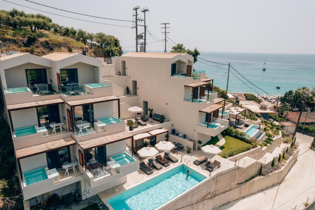 an aerial view of a house with a swimming pool at Somnus Suites Parga in Parga