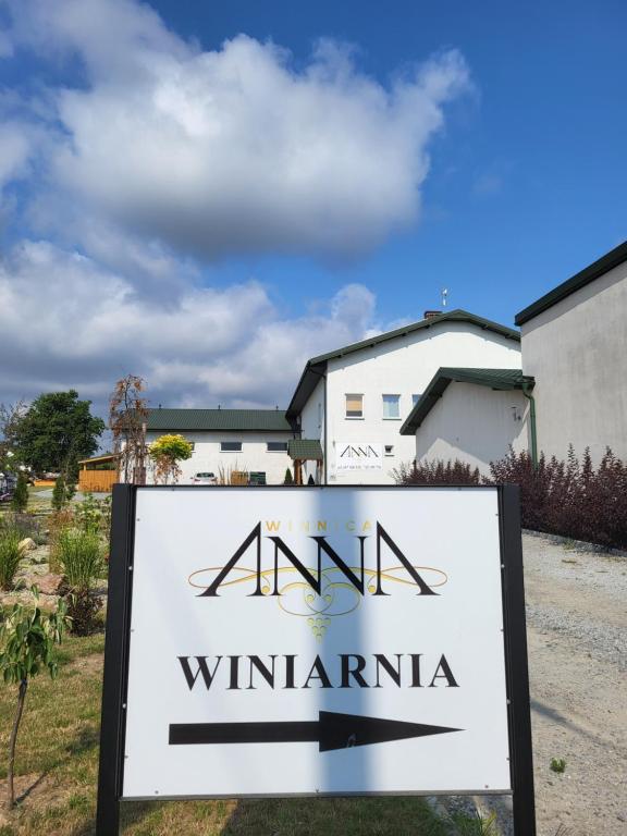 a sign in front of a villa at Winnica Anna Noclegi in Krośnice