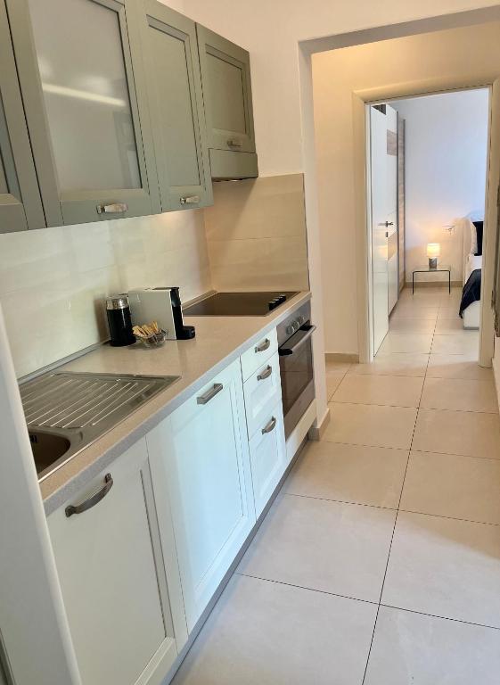 Kuchyňa alebo kuchynka v ubytovaní Apartments Domani
