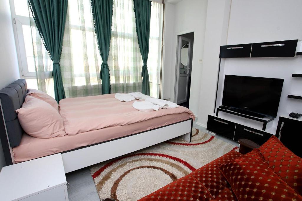 Postel nebo postele na pokoji v ubytování Hotel Xhema