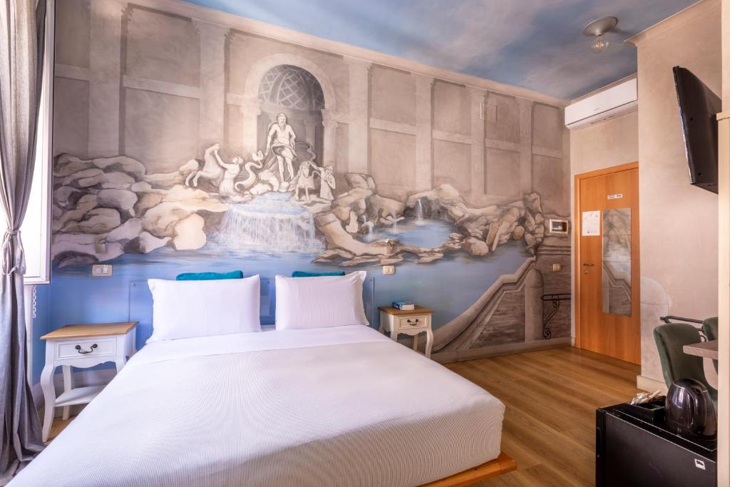 um quarto com uma cama grande e uma pintura na parede em Suites Trastevere em Roma