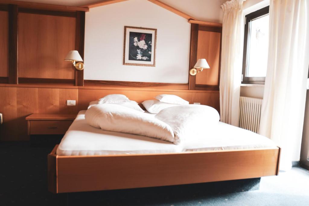 Postel nebo postele na pokoji v ubytování Pension Schweigkofler