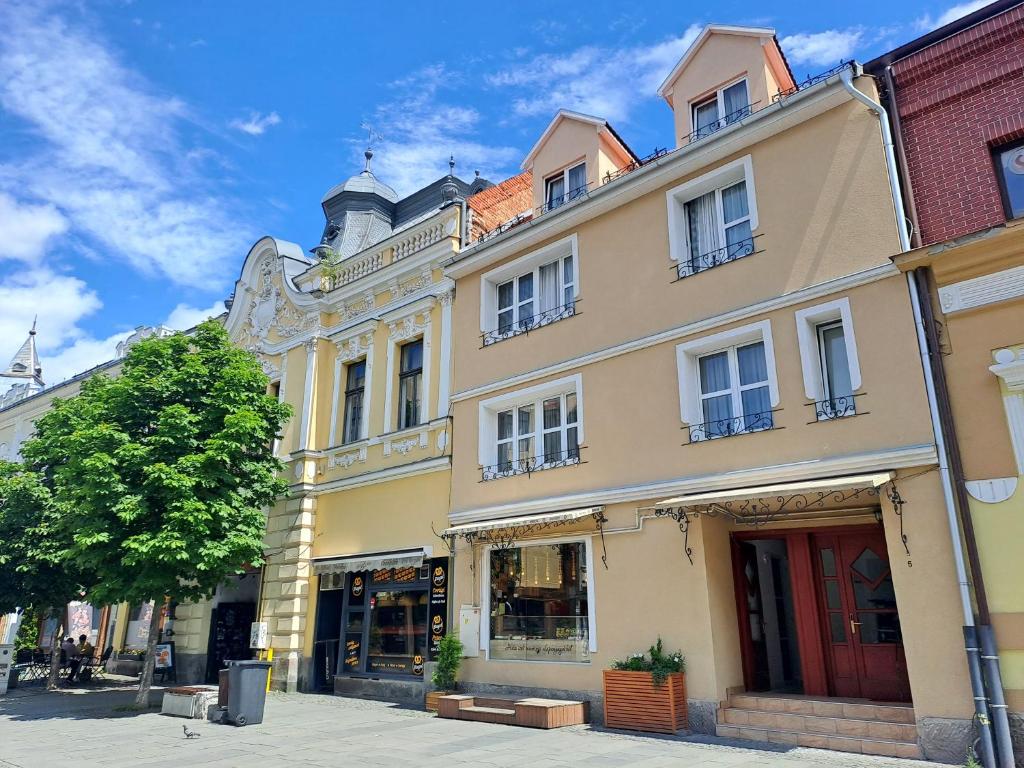a building on a street in a city at 7 Levél Panzió, Ultra Central, Self Check-in, Self-Catering in Miercurea-Ciuc