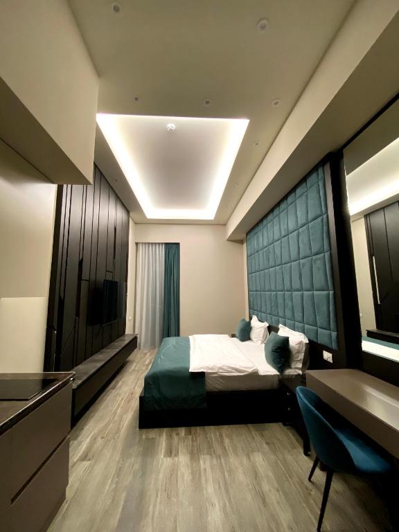 Postel nebo postele na pokoji v ubytování SOHO Hotel City Centre
