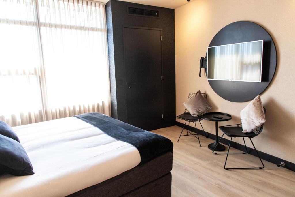Postel nebo postele na pokoji v ubytování Palace Hotel Zandvoort