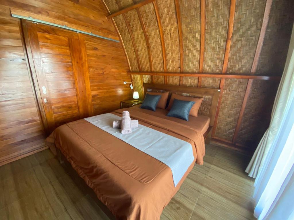 Postel nebo postele na pokoji v ubytování D'Yoga Bamboo House