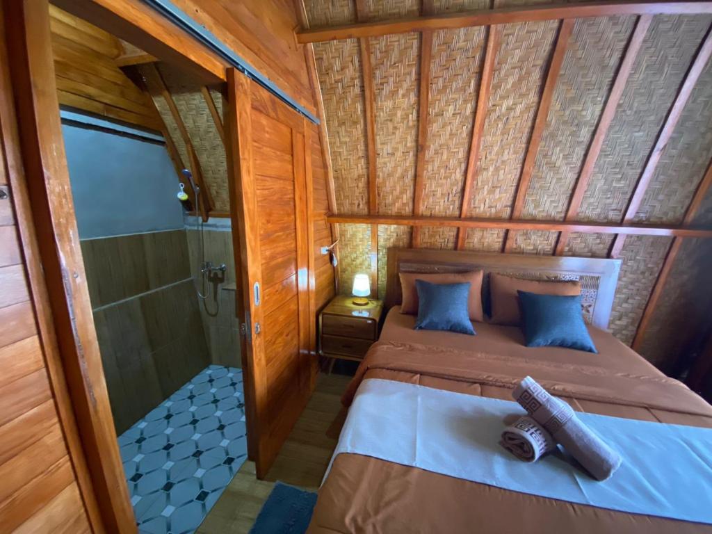 Postel nebo postele na pokoji v ubytování D'Yoga Bamboo House