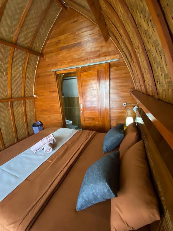 Postel nebo postele na pokoji v ubytování D'Yoga Bamboo House