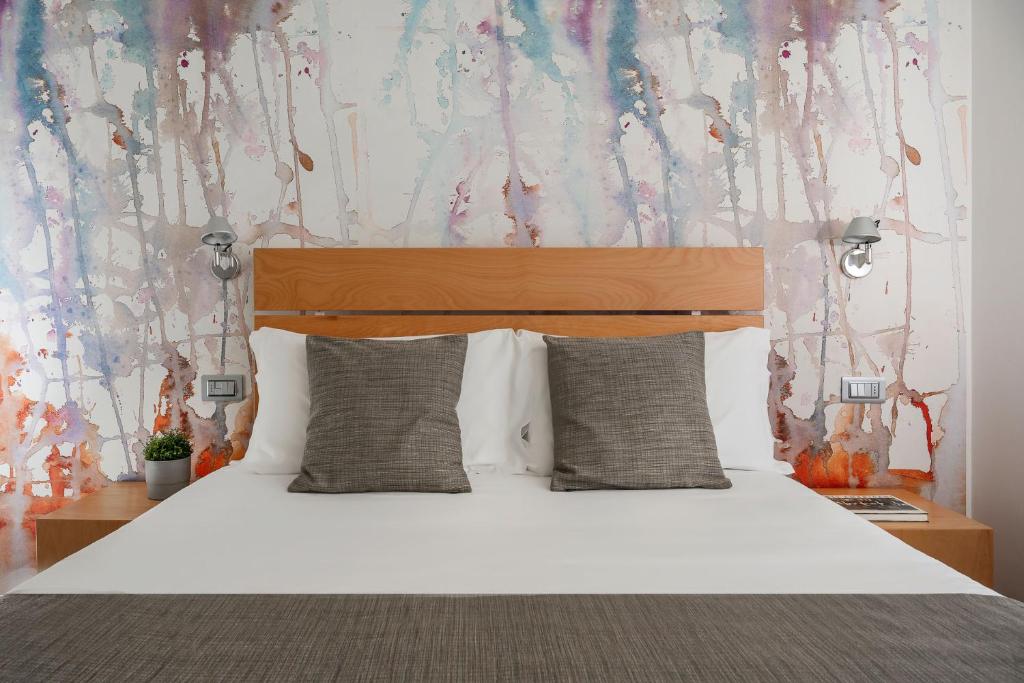 Postel nebo postele na pokoji v ubytování Hotel Rex - Fronte mare Riccione
