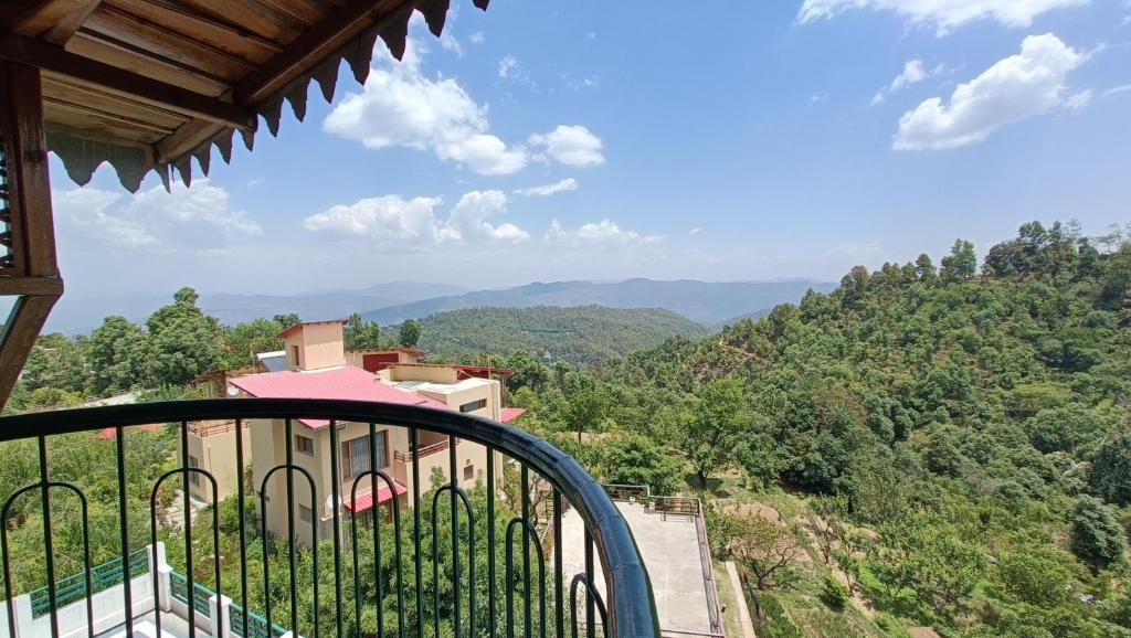 a view from the balcony of a house in the mountains at The Montana Hotel in Mukteswar