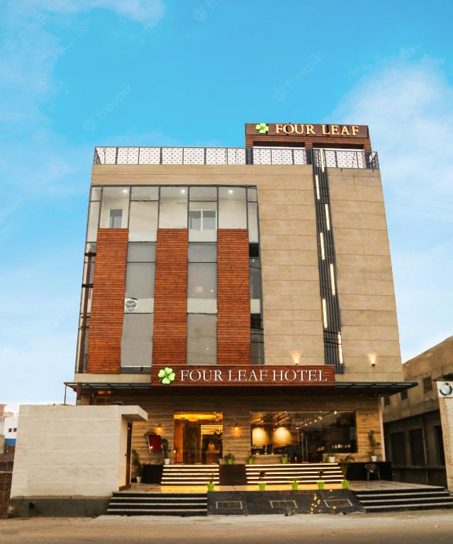 a front view of a hotel with a four leaf hotel at Four Leaf Hotel, Kasganj in Kāsganj