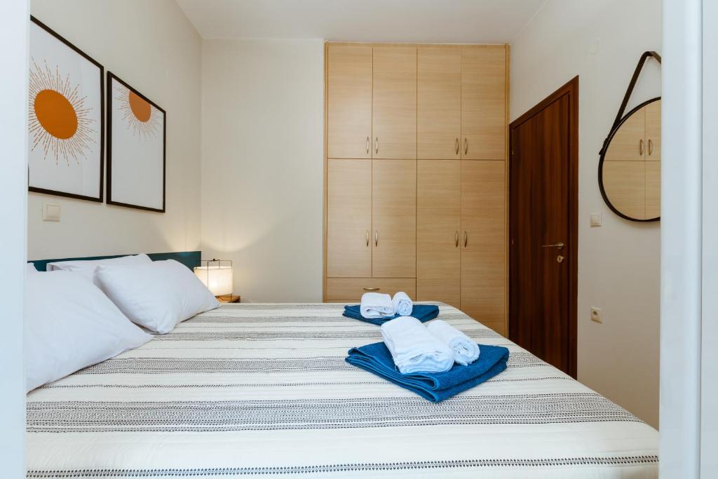 Postel nebo postele na pokoji v ubytování Harmony Apartments