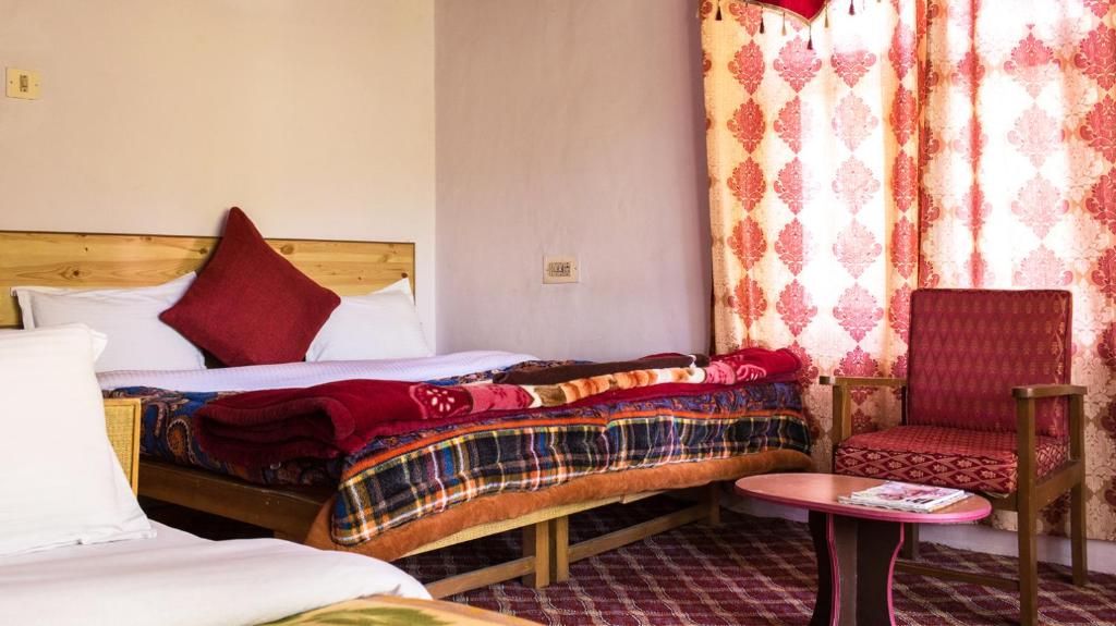 Rúm í herbergi á Siala Guest House