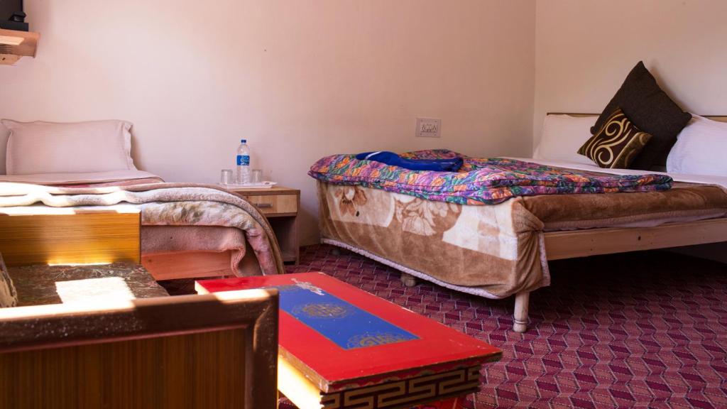 Rúm í herbergi á Siala Guest House
