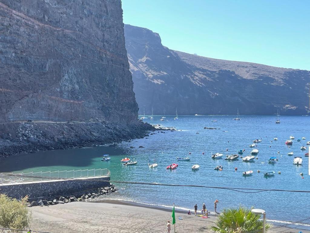 a group of people in the water at a beach at Apartamento La Playa in Valle Gran Rey