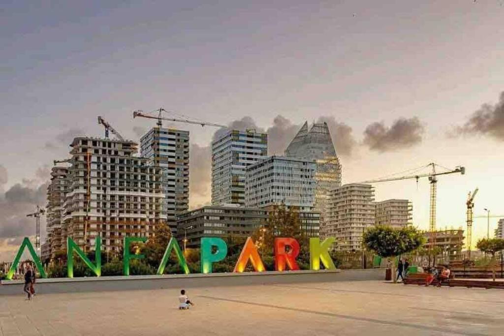 a city with a sign that reads a park at Superbe Appartement sécurisé avec un balcon in Casablanca