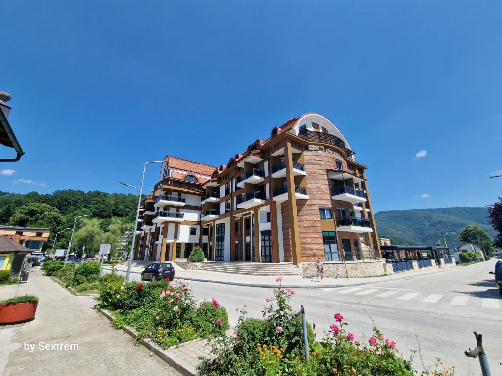 a large building on the side of a street at Apartman Paradise Fojnica in Fojnica