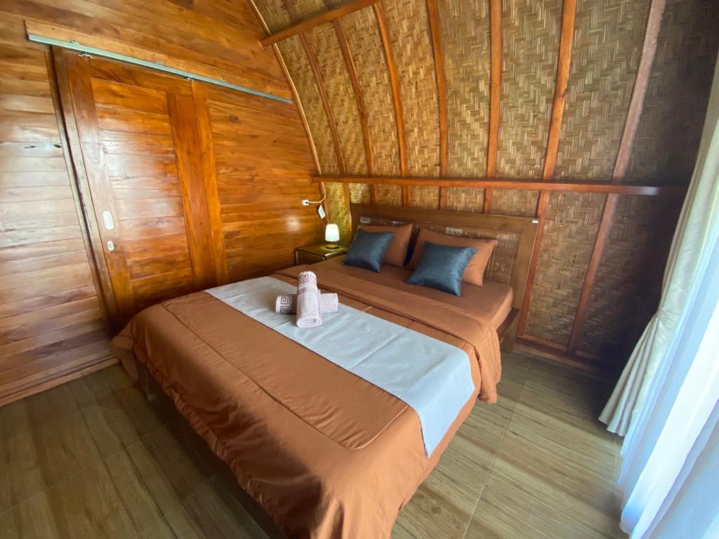 Postel nebo postele na pokoji v ubytování D'Yoga Bamboo House