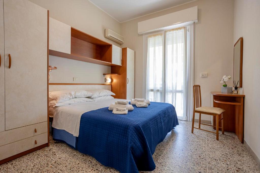 Postel nebo postele na pokoji v ubytování Hotel Stella Del Mare