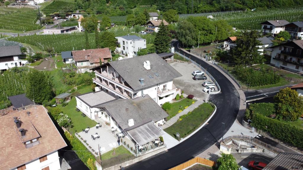 an aerial view of a large house in a village at Pension Lahn in Rablà