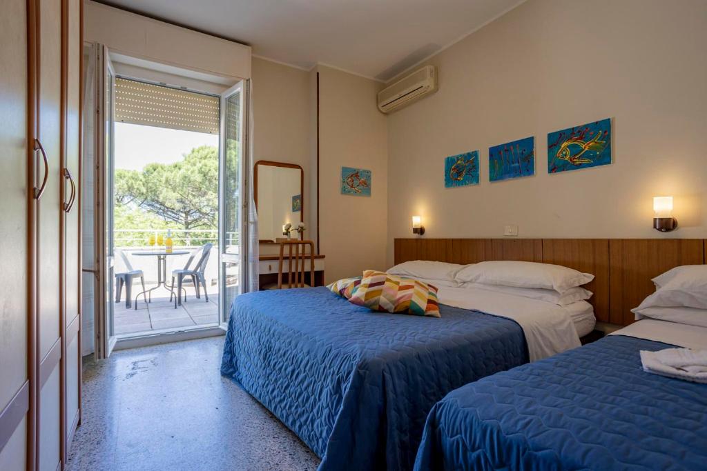 Postel nebo postele na pokoji v ubytování Hotel Stella Del Mare