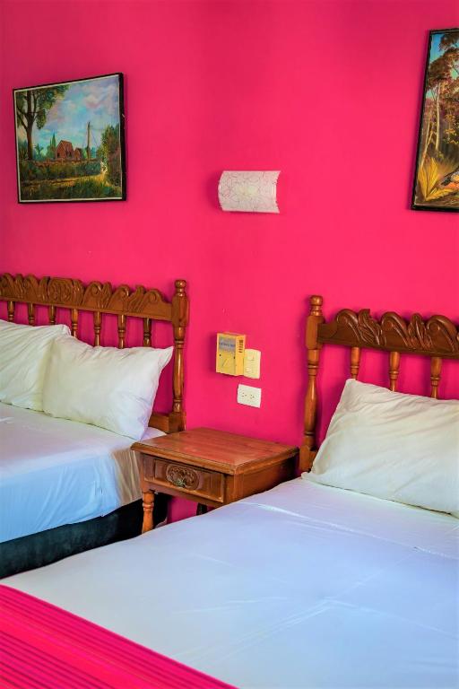 Postel nebo postele na pokoji v ubytování Hotel San Juan Mérida