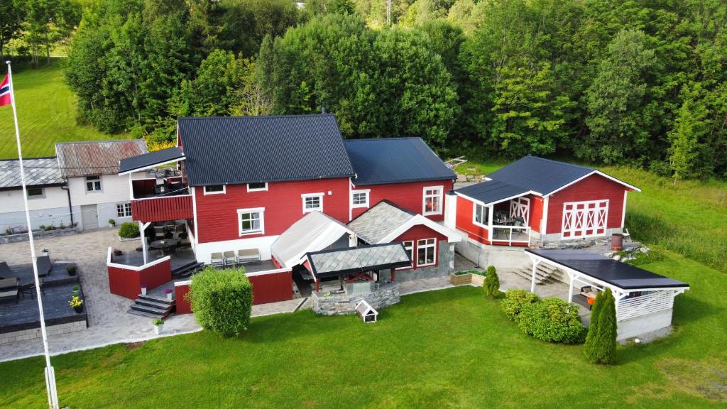 an aerial view of a large red barn at Koselig låve in Ålesund
