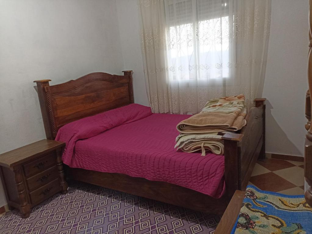 מיטה או מיטות בחדר ב-Kamzoun