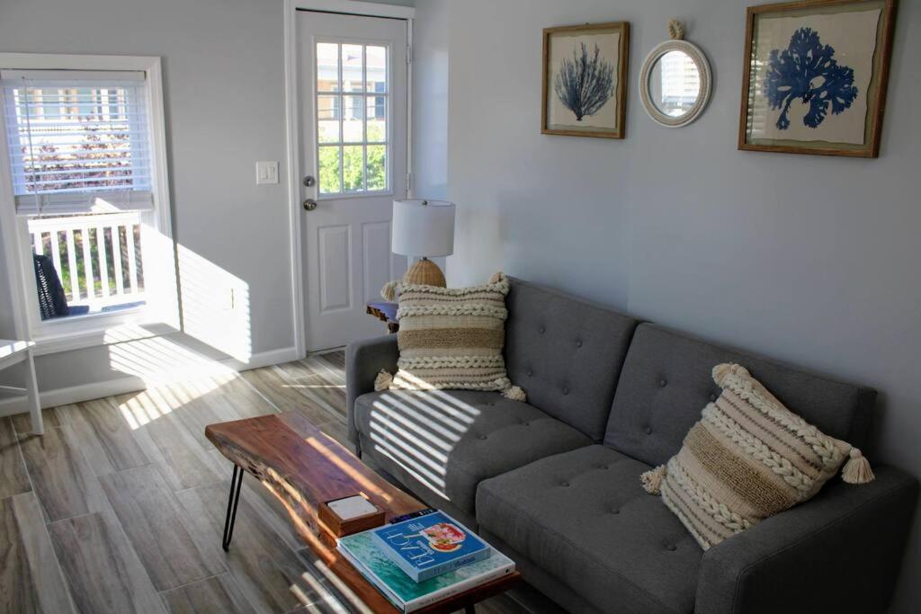 a living room with a couch and a table at The Clark - Suite 2W - Ocean Grove near Asbury in Ocean Grove