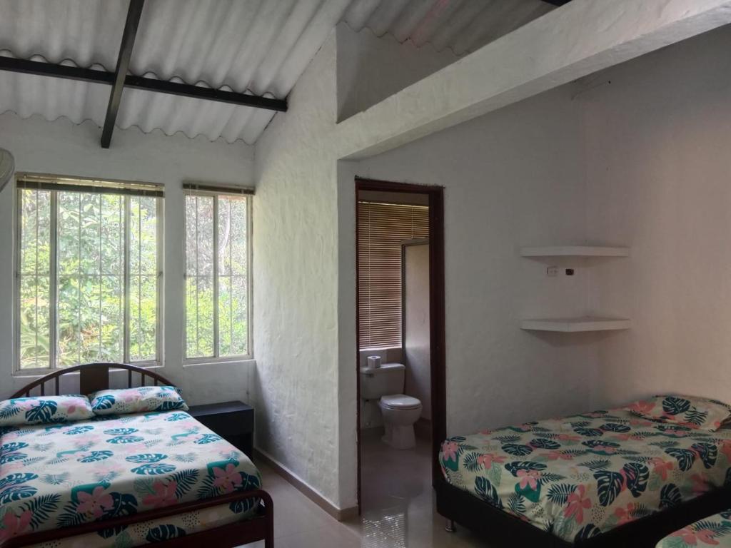 Postel nebo postele na pokoji v ubytování CASA CORAL