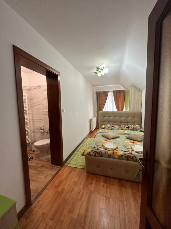 Postel nebo postele na pokoji v ubytování CASA IKA&MATEI