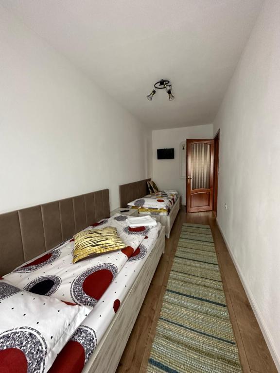 Postel nebo postele na pokoji v ubytování CASA IKA&MATEI
