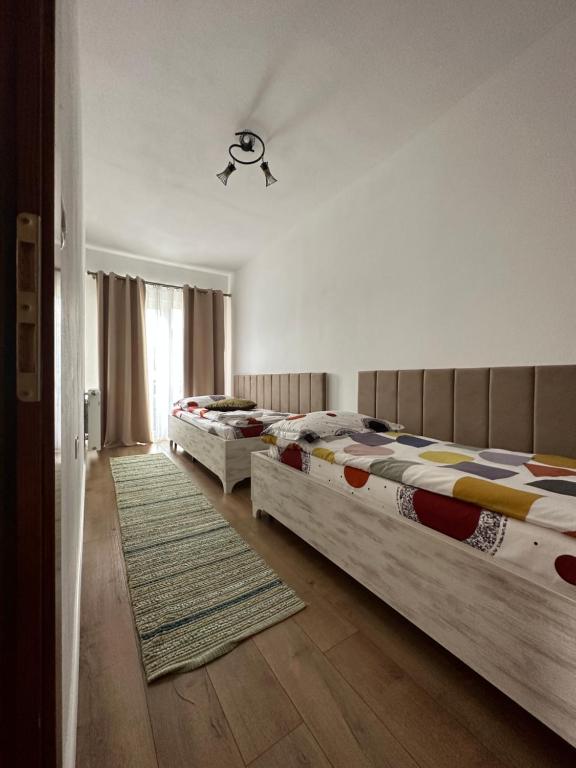 Postel nebo postele na pokoji v ubytování CASA IKA&MATEI