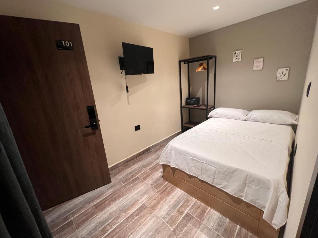 Voodi või voodid majutusasutuse Casa Indigo Laureles-Estadio con Jacuzzi toas