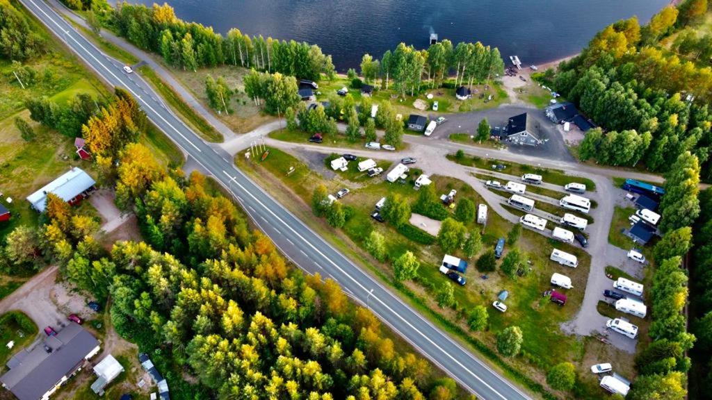 an aerial view of a parking lot with a highway at Arctic Camping Finland in Pello