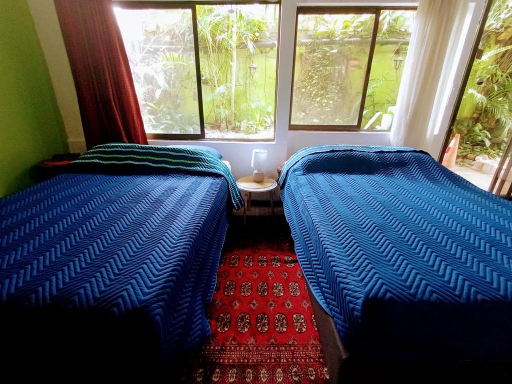 Postel nebo postele na pokoji v ubytování Nirvana Apartament Hostal
