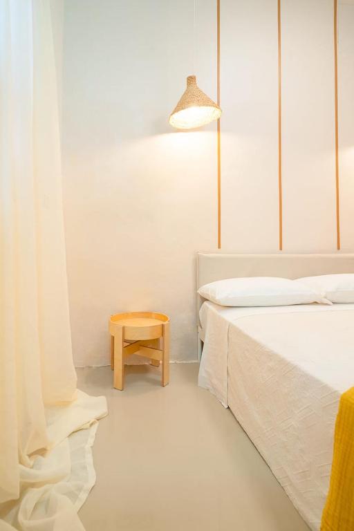 Postel nebo postele na pokoji v ubytování Hostal Mamà Mambò - Zona Colonial