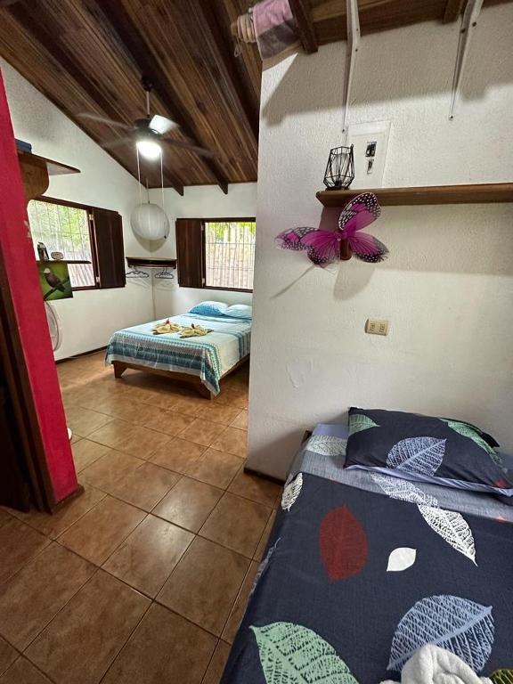 Postel nebo postele na pokoji v ubytování Mono Azul Cahuita