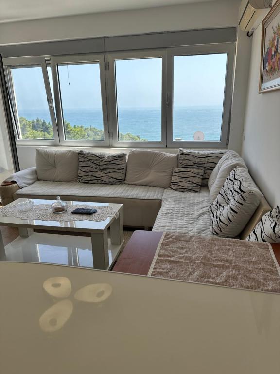 a living room with a couch and a table at Apartmani Hills in Ulcinj