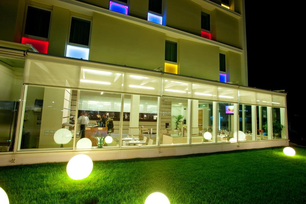 a large building with a lot of windows at Breaking Business Hotel in Mosciano SantʼAngelo