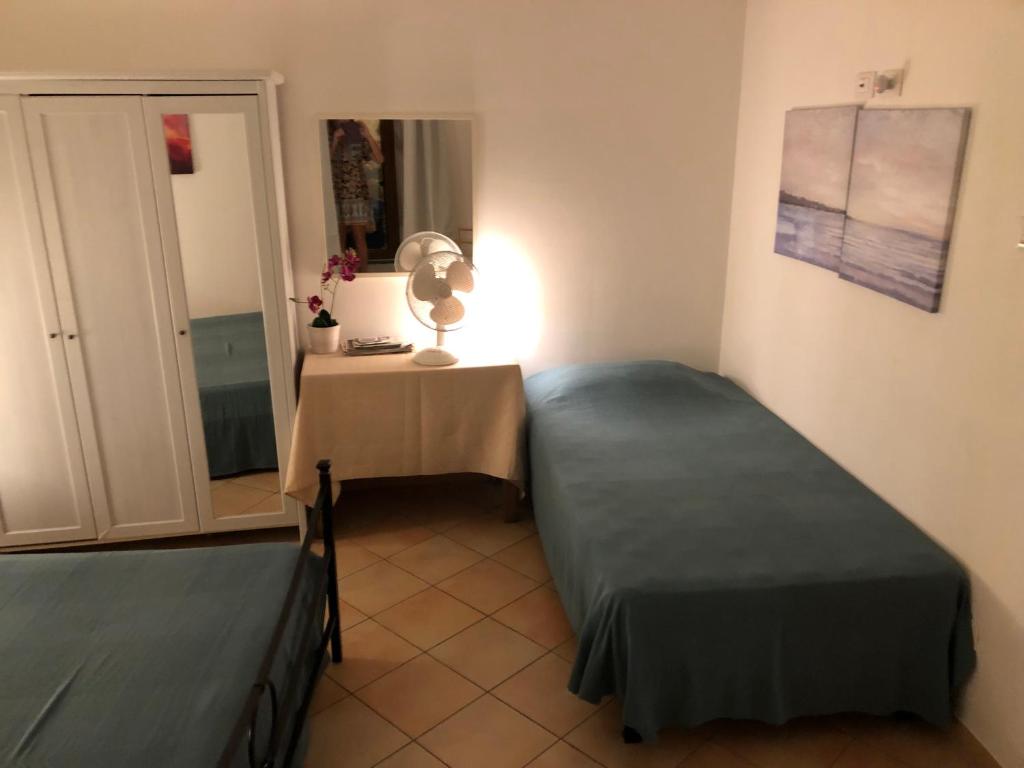 Postel nebo postele na pokoji v ubytování Il Cortile del Contadino