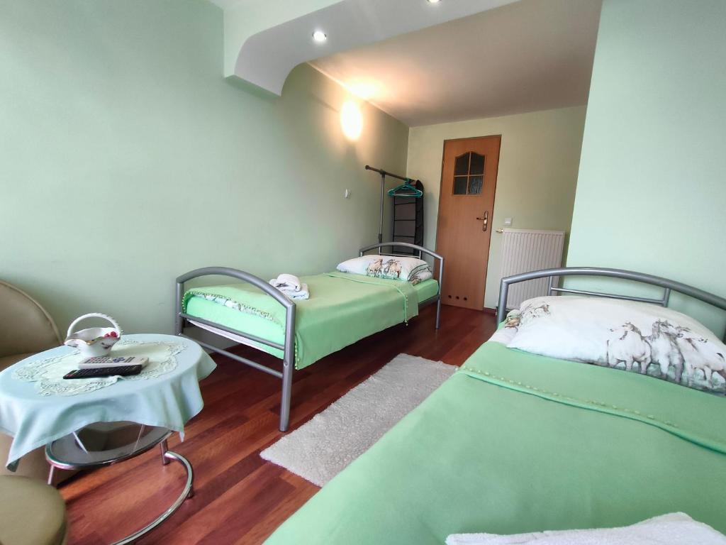 Posteľ alebo postele v izbe v ubytovaní Bajeczny Wypoczynek Apartamenty