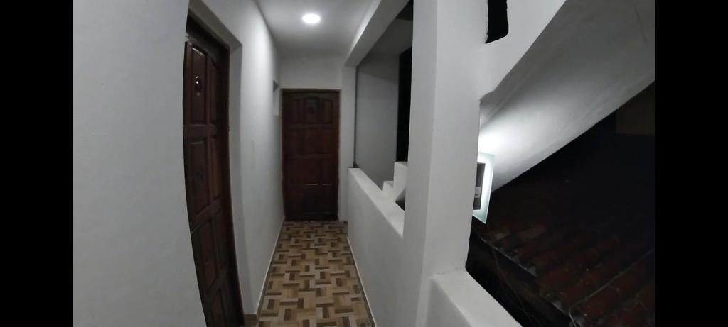 a hallway with a stairway with a stair case at Lo de franco in Salta